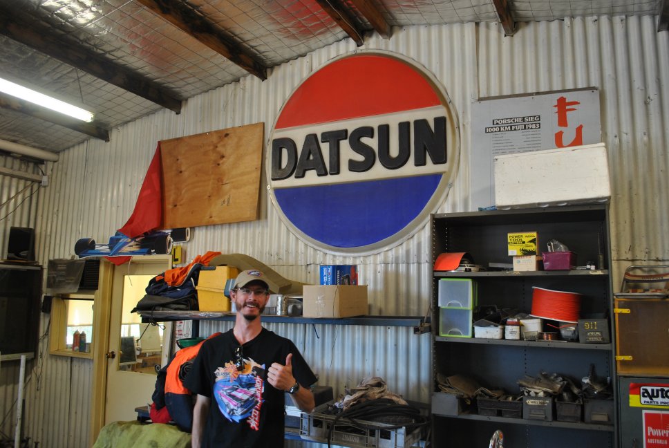 11 - Ross with Datsun dealership sign.JPG